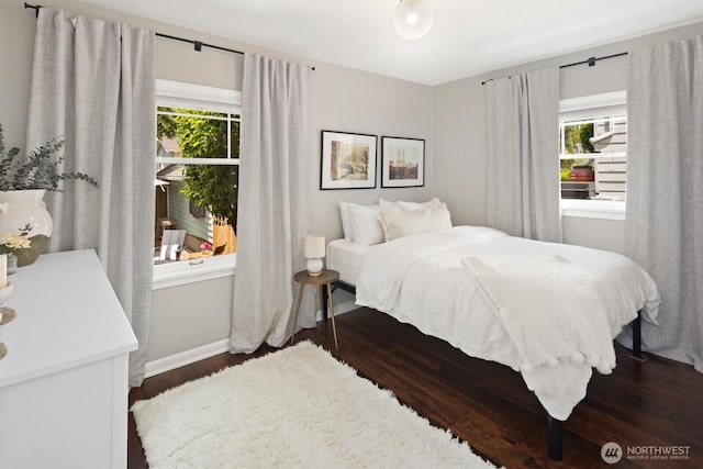 4106 SW Kenyon St, Seattle, WA 98136 - bedroom featuring dark wood-style floors and baseboards