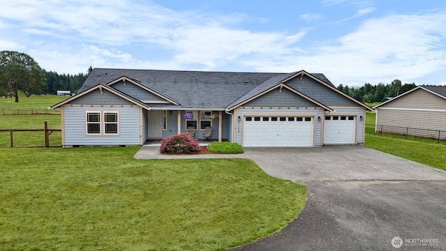 17133 123rd Ct SE, Yelm, WA 98597 - view of front of house featuring driveway, an attached garage, and covered porch