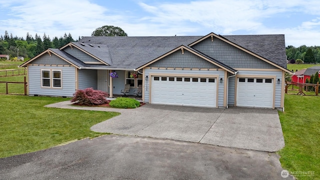 17133 123rd Ct SE, Yelm, WA 98597 - view of front facade with a garage, driveway, covered porch, and roof with shingles