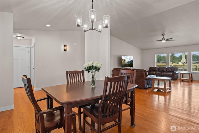 17133 123rd Ct SE, Yelm, WA 98597 - dining space featuring light wood-style floors, ceiling fan, a chandelier, vaulted ceiling, and recessed lighting