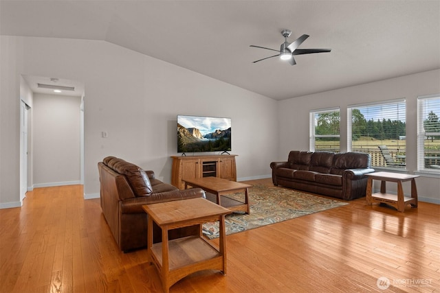 17133 123rd Ct SE, Yelm, WA 98597 - living room with vaulted ceiling, a ceiling fan, and light wood-style flooring