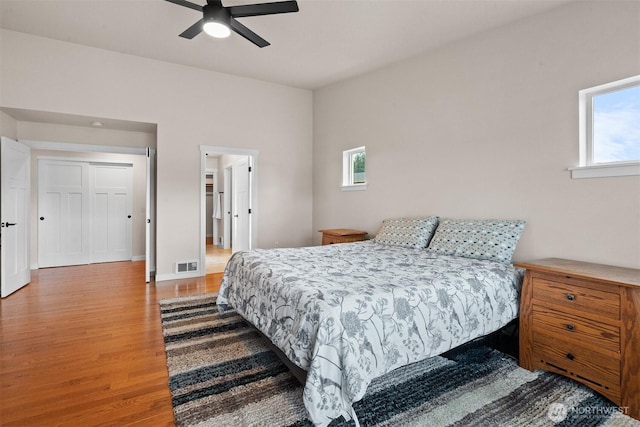 17133 123rd Ct SE, Yelm, WA 98597 - bedroom with wood finished floors, multiple windows, and ceiling fan