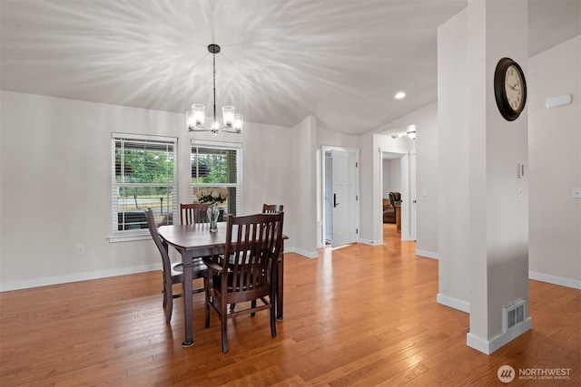 17133 123rd Ct SE, Yelm, WA 98597 - dining space featuring a chandelier, light wood-style flooring, and vaulted ceiling