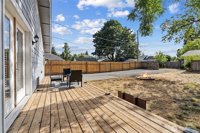 3914 N Gove St, Tacoma, WA 98407 - wooden deck with an outdoor fire pit and a fenced backyard