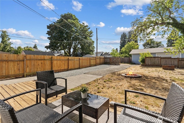 3914 N Gove St, Tacoma, WA 98407 - fenced backyard with a fire pit, a deck, and a patio area