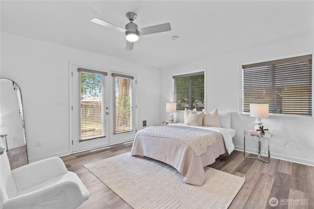 3914 N Gove St, Tacoma, WA 98407 - bedroom featuring access to exterior, wood finished floors, french doors, and a ceiling fan