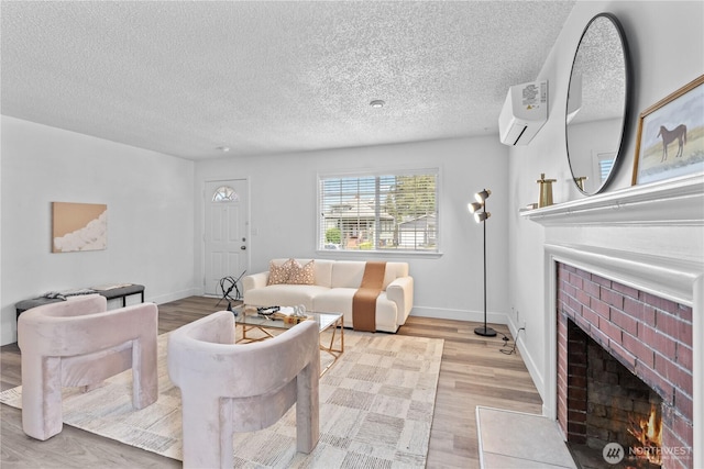 3914 N Gove St, Tacoma, WA 98407 - living room with a wall mounted AC, a brick fireplace, a textured ceiling, and light wood-type flooring