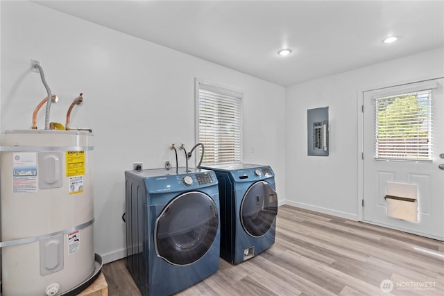 3914 N Gove St, Tacoma, WA 98407 - laundry area featuring secured water heater, electric panel, independent washer and dryer, light wood-style floors, and recessed lighting