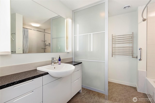 500 Mercer St Unit R325, Seattle, WA 98109 - bathroom featuring radiator, vanity, and a towel warmer