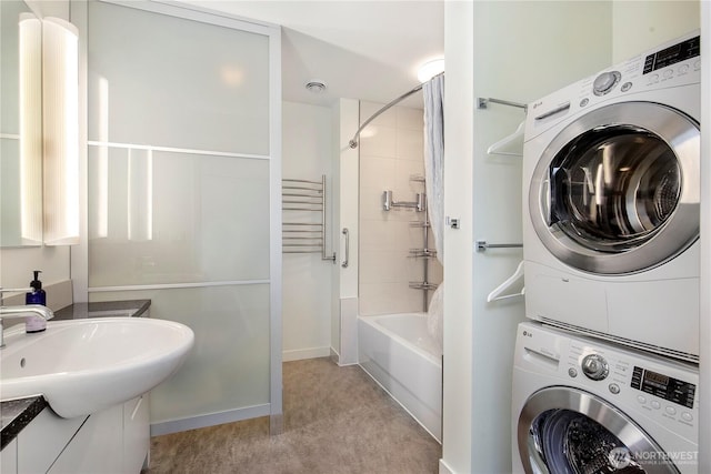 500 Mercer St Unit R325, Seattle, WA 98109 - full bathroom with stacked washer and clothes dryer, shower / bath combination, and vanity