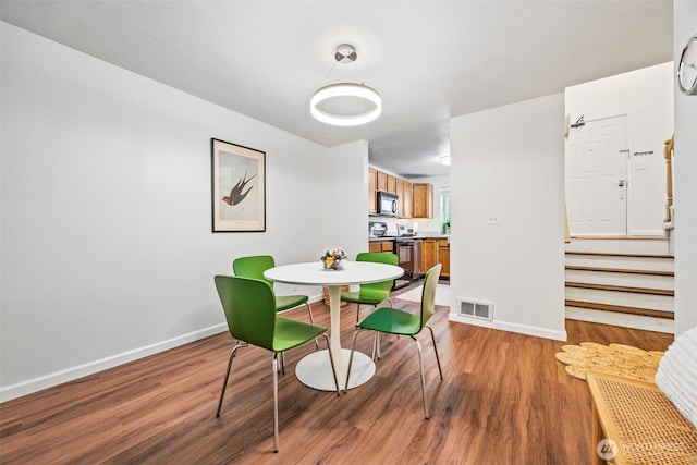 9522 1st Ave NE Unit B6, Seattle, WA 98115 - dining room with wood finished floors and stairs
