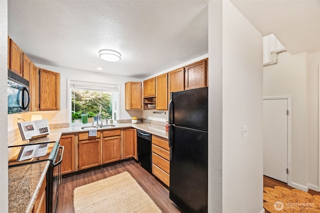9522 1st Ave NE Unit B6, Seattle, WA 98115 - kitchen with black appliances, light countertops, dark wood-style flooring, a textured ceiling, and brown cabinetry