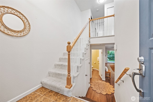 9522 1st Ave NE Unit B6, Seattle, WA 98115 - stairs featuring baseboards and tile patterned floors