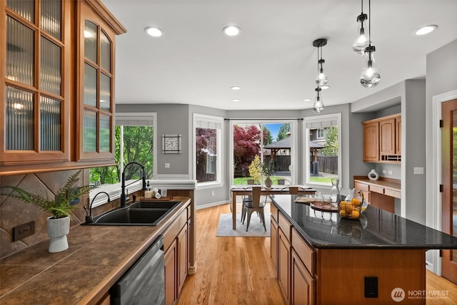 32216 Bruckners Way, Black Diamond, WA 98010 - kitchen featuring stainless steel dishwasher, light wood-type flooring, plenty of natural light, dark countertops, and recessed lighting