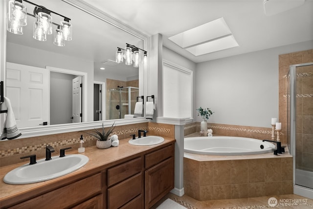 32216 Bruckners Way, Black Diamond, WA 98010 - full bathroom featuring a stall shower, a garden tub, tile patterned floors, double vanity, and a skylight