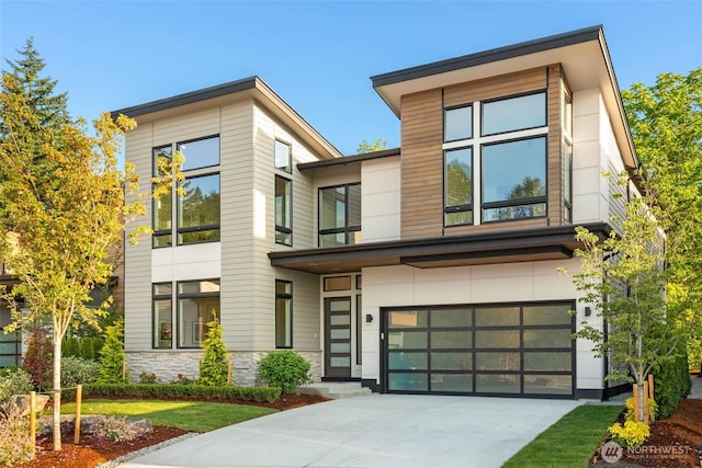 21025 SE 80th St, Issaquah, WA 98027 - contemporary house with an attached garage, concrete driveway, and stone siding