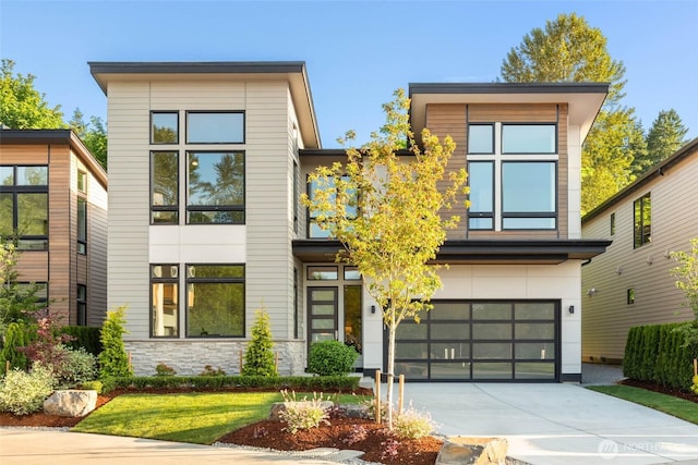 21025 SE 80th St, Issaquah, WA 98027 - contemporary house with a garage, concrete driveway, and stone siding
