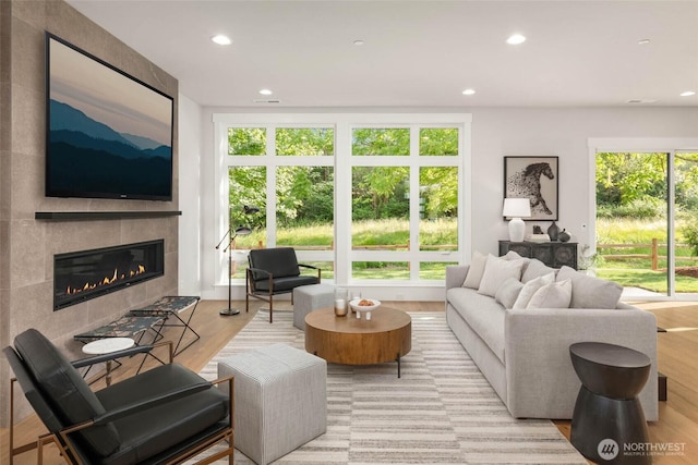 21025 SE 80th St, Issaquah, WA 98027 - living room featuring a fireplace, recessed lighting, and wood finished floors