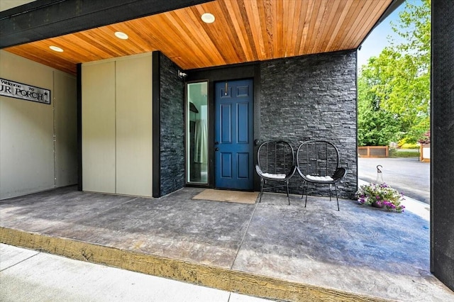 5109S 364th St, Auburn, WA 98001 - view of exterior entry with stone siding and a patio area