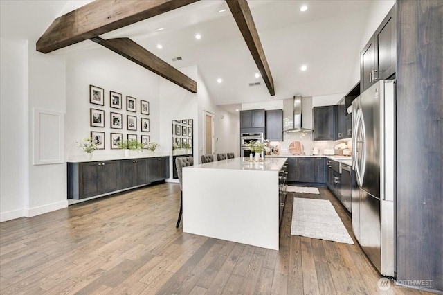5109S 364th St, Auburn, WA 98001 - kitchen with wall chimney exhaust hood, stainless steel appliances, high vaulted ceiling, beam ceiling, and a kitchen island