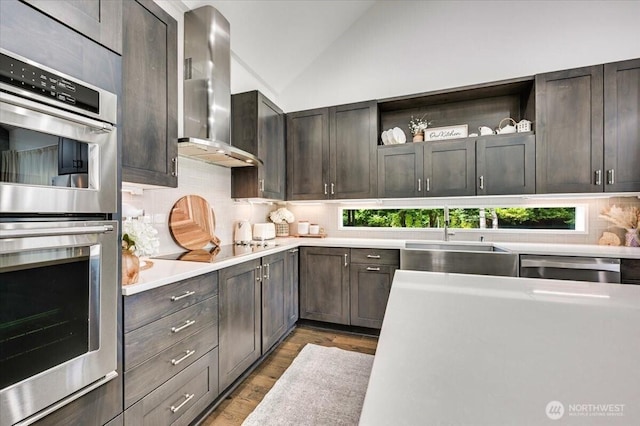 5109S 364th St, Auburn, WA 98001 - kitchen with appliances with stainless steel finishes, wall chimney exhaust hood, open shelves, backsplash, and light countertops