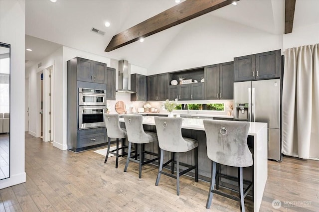 5109S 364th St, Auburn, WA 98001 - kitchen featuring appliances with stainless steel finishes, wall chimney range hood, light countertops, open shelves, and beamed ceiling