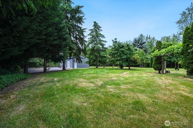 5109S 364th St, Auburn, WA 98001 - view of green lawn featuring an outdoor structure and a garage