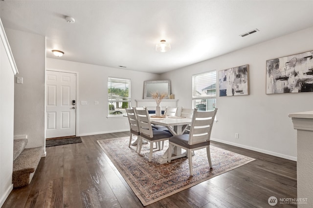 1105 Nunnally Ave NW, Orting, WA 98360 - dining space featuring dark wood-type flooring and stairs