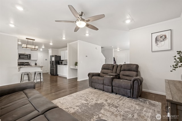1105 Nunnally Ave NW, Orting, WA 98360 - living area featuring dark wood-style flooring, ceiling fan, recessed lighting, and crown molding