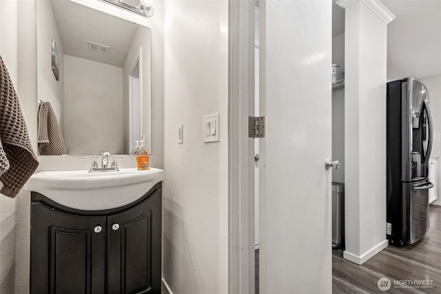 1105 Nunnally Ave NW, Orting, WA 98360 - bathroom featuring wood finished floors and vanity