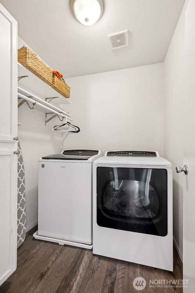 1105 Nunnally Ave NW, Orting, WA 98360 - washroom with washer and clothes dryer and wood finished floors