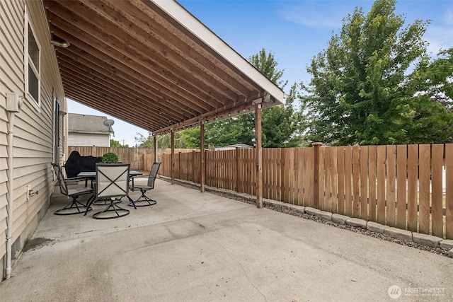 1105 Nunnally Ave NW, Orting, WA 98360 - fenced backyard featuring a patio and outdoor dining space