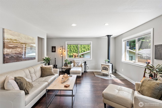 134 Robin Ln, Port Ludlow, WA 98365 - living area with a wood stove, recessed lighting, and dark wood-type flooring