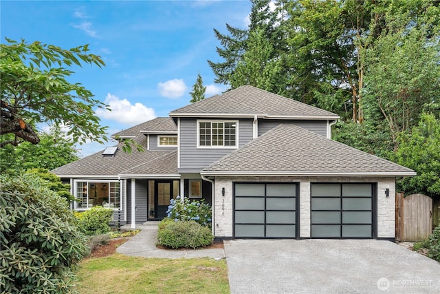 3696 169th Ave NE, Bellevue, WA 98008 - view of front of house with an attached garage, driveway, a shingled roof, and covered porch