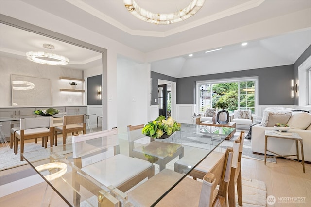 3696 169th Ave NE, Bellevue, WA 98008 - dining room featuring a raised ceiling, a decorative wall, ornamental molding, wainscoting, and recessed lighting