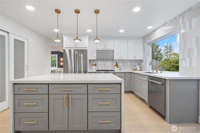 3696 169th Ave NE, Bellevue, WA 98008 - kitchen featuring appliances with stainless steel finishes, gray cabinets, healthy amount of natural light, decorative backsplash, and recessed lighting