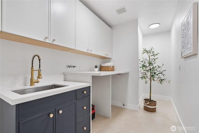 3696 169th Ave NE, Bellevue, WA 98008 - laundry room featuring cabinet space and light tile patterned floors