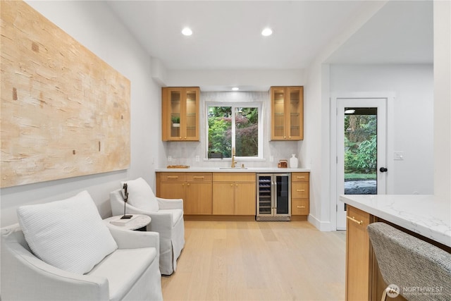 3696 169th Ave NE, Bellevue, WA 98008 - indoor wet bar featuring wine cooler, plenty of natural light, recessed lighting, light wood-style flooring, and backsplash