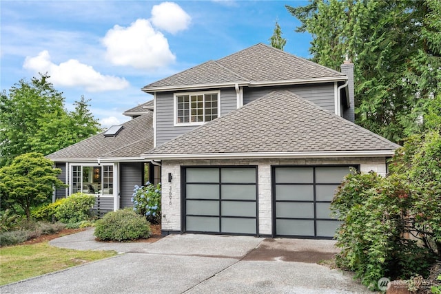 3696 169th Ave NE, Bellevue, WA 98008 - traditional-style home featuring concrete driveway, a garage, a shingled roof, and a chimney