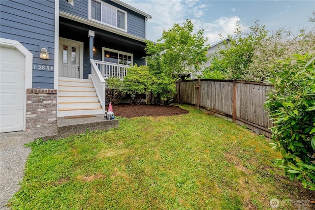 13858 Dogwood Ct, Sultan, WA 98294 - view of yard featuring covered porch and a garage