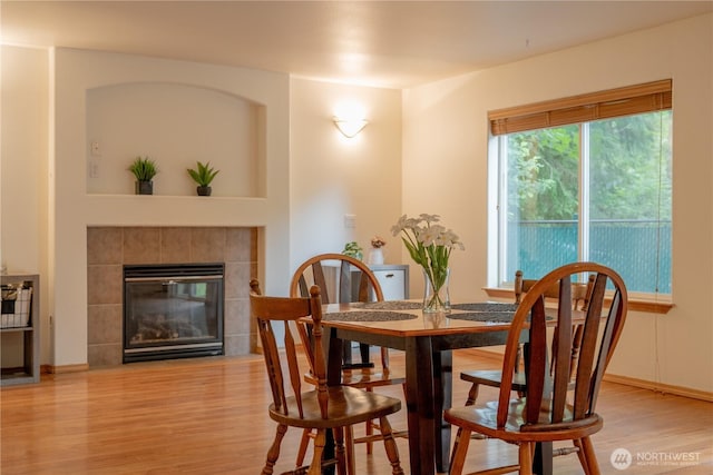13858 Dogwood Ct, Sultan, WA 98294 - dining room featuring light wood-style floors and a fireplace