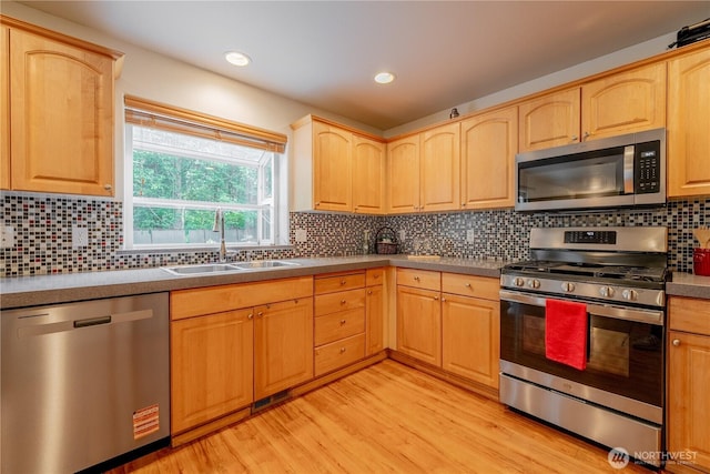 13858 Dogwood Ct, Sultan, WA 98294 - kitchen featuring appliances with stainless steel finishes, light brown cabinets, light wood-type flooring, tasteful backsplash, and recessed lighting