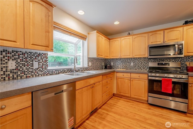 13858 Dogwood Ct, Sultan, WA 98294 - kitchen featuring stainless steel appliances, light brown cabinetry, light wood-style flooring, tasteful backsplash, and recessed lighting