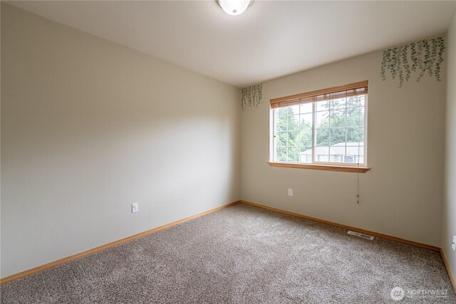 13858 Dogwood Ct, Sultan, WA 98294 - spare room featuring carpet floors and baseboards