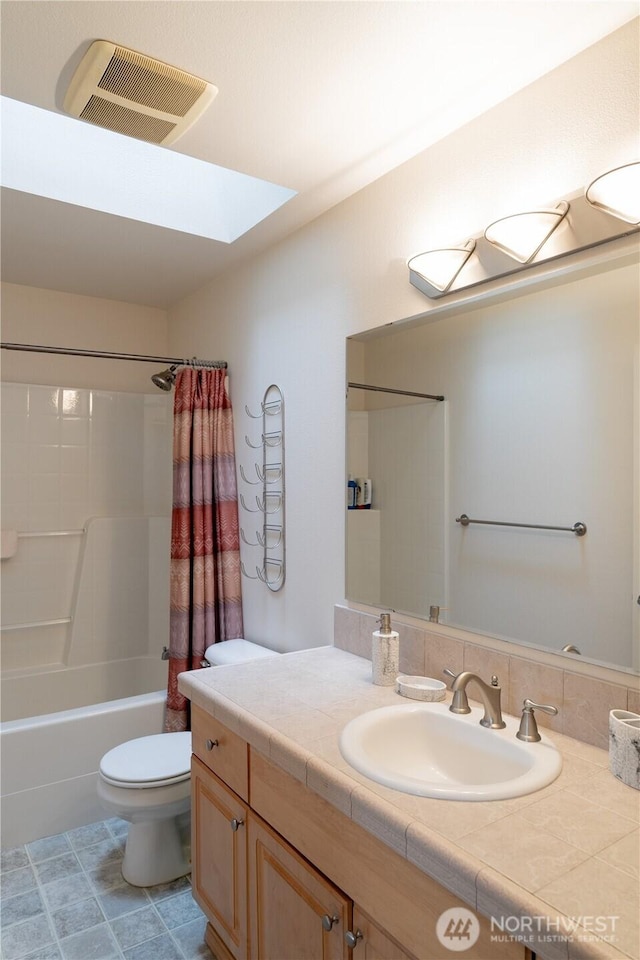 13858 Dogwood Ct, Sultan, WA 98294 - full bath with vanity, shower / bath combo with shower curtain, a skylight, and tile patterned flooring