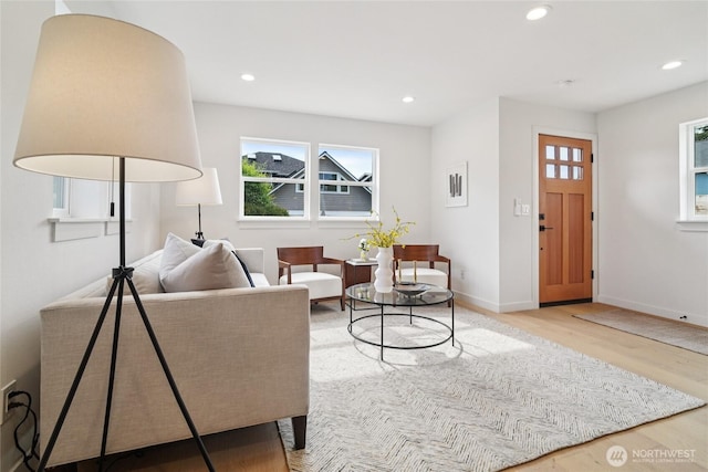 8227 Latona Ave NE, Seattle, WA 98115 - living area featuring wood finished floors, plenty of natural light, and recessed lighting