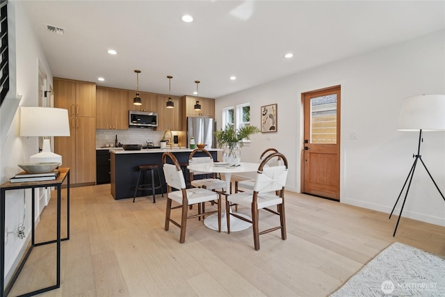 8227 Latona Ave NE, Seattle, WA 98115 - dining area with recessed lighting and light wood-style floors