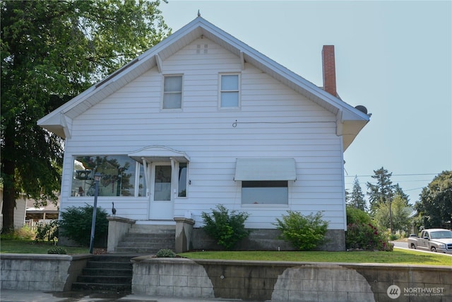 202 E 3rd Ave, Ritzville, WA 99169 - view of front of home featuring a chimney