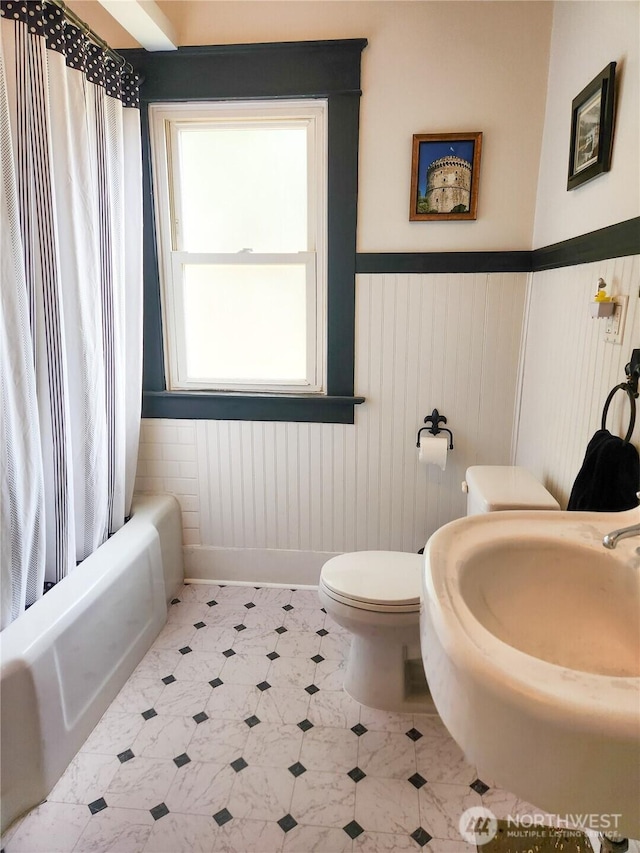 202 E 3rd Ave, Ritzville, WA 99169 - full bath with a wainscoted wall and shower / tub combo