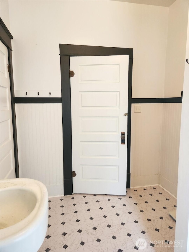 202 E 3rd Ave, Ritzville, WA 99169 - bathroom with a wainscoted wall and tile patterned floors